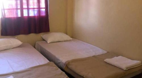 Ένα ή περισσότερα κρεβάτια σε δωμάτιο στο hotel kings