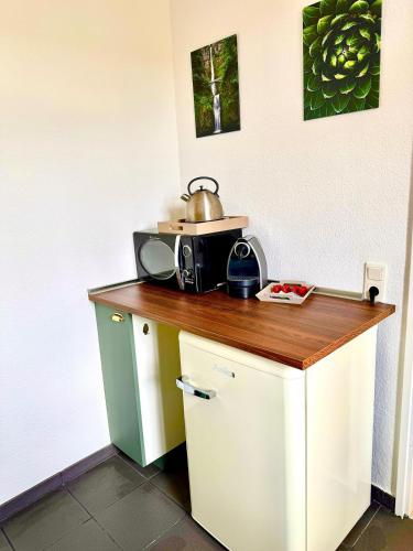 a kitchen with a counter with a microwave on it at Zuhause im Ruhrgebiet 4 mit Balkon in Oberhausen