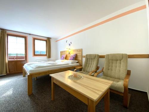 Postel nebo postele na pokoji v ubytování Rodinný "Hotel U Můstků"