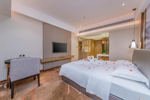Televisyen dan/atau pusat hiburan di Meihao Lizhi Hotel Guangzhou Nansha Tianhou Temple Branch