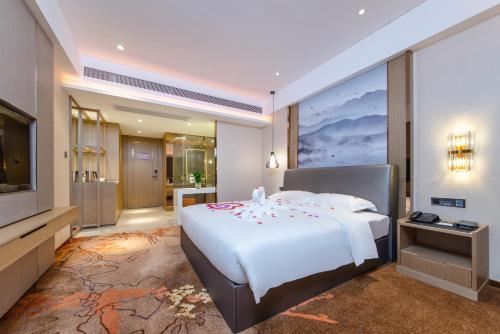 Katil atau katil-katil dalam bilik di Meihao Lizhi Hotel Guangzhou Nansha Tianhou Temple Branch