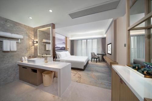 Katil atau katil-katil dalam bilik di Meihao Lizhi Hotel Guangzhou Nansha Tianhou Temple Branch