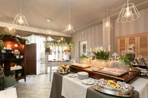 a kitchen with a buffet with food on a table at Residenza il Punto in Perugia