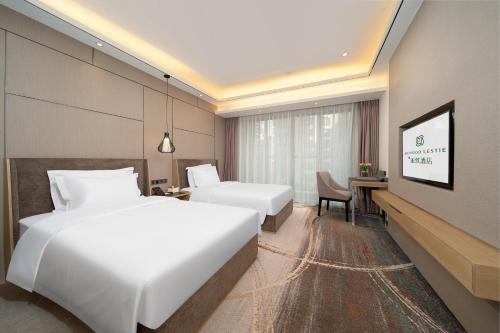 Katil atau katil-katil dalam bilik di Meihao Lizhi Hotel Guangzhou Nansha Tianhou Temple Branch