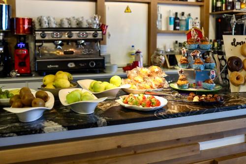 a kitchen counter with many plates of food on it at Playa de Camariñas in Camariñas
