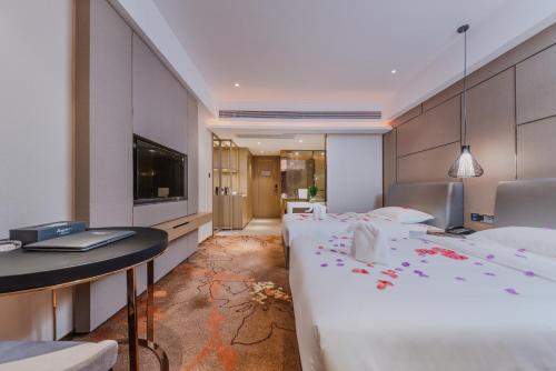 Katil atau katil-katil dalam bilik di Meihao Lizhi Hotel Guangzhou Nansha Tianhou Temple Branch