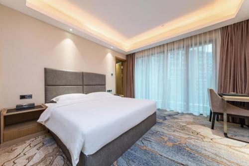 Katil atau katil-katil dalam bilik di Meihao Lizhi Hotel Guangzhou Nansha Tianhou Temple Branch