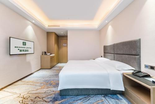 Katil atau katil-katil dalam bilik di Meihao Lizhi Hotel Guangzhou Nansha Tianhou Temple Branch