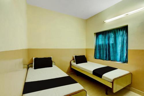 Postel nebo postele na pokoji v ubytování SPOT ON SS Residency