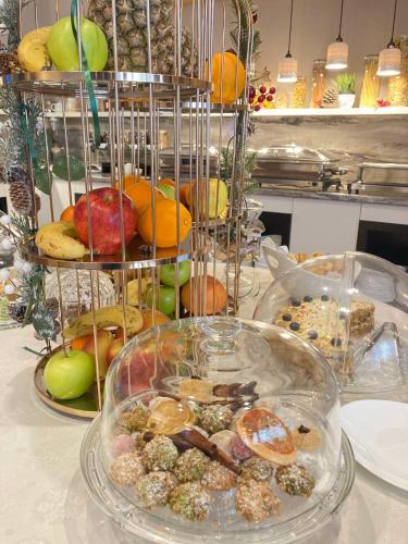 a table with a bunch of different types of food at Best Boutique Hotel in Stara Zagora