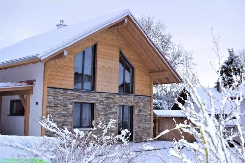 a house in the winter with snow at Alpenchalet Allgäu in Oy-Mittelberg