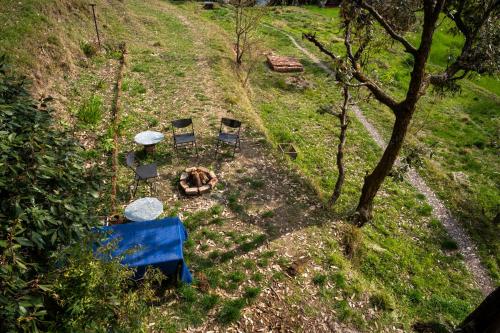 an overhead view of a table and chairs on a hill at Naddi Castle in McLeod Ganj