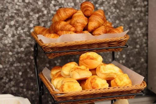 two baskets full of croissants and other breads at karaksa hotel TOKYO STATION in Tokyo
