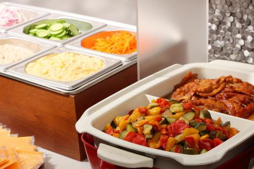 a tray of food with vegetables and meat on a counter at karaksa hotel TOKYO STATION in Tokyo