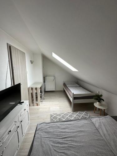 a room with a bed and a couch in it at Mašenka in Gospić