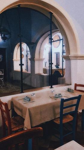 a dining room with a table and two chairs at Casa Camboni-Dimora Storica Bed & Breakfast in San Vito