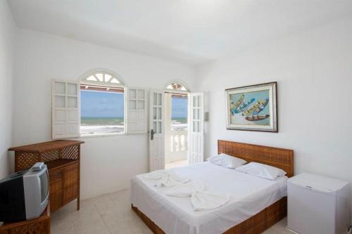 מיטה או מיטות בחדר ב-Hotel Portal Do Mar
