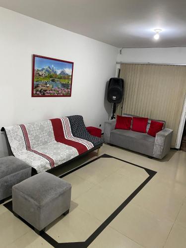 a living room with two couches and a couch at Confort 13-47 in Cali