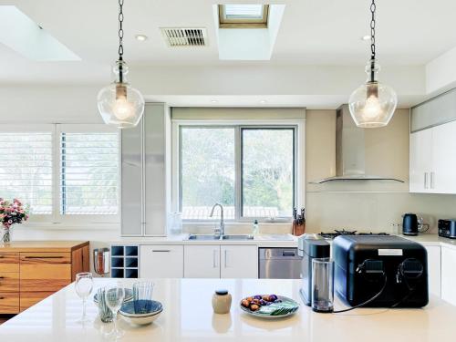 a kitchen with a counter with a coffee maker on it at Luxurious Comfort with Bay Views in Frankston South