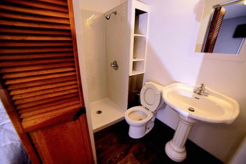 a bathroom with a toilet and a sink at Cozy Private Room With Two Beds in Anchorage