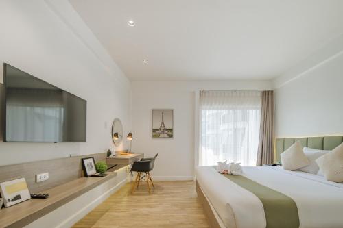 Ένα ή περισσότερα κρεβάτια σε δωμάτιο στο Mittapan Hotel
