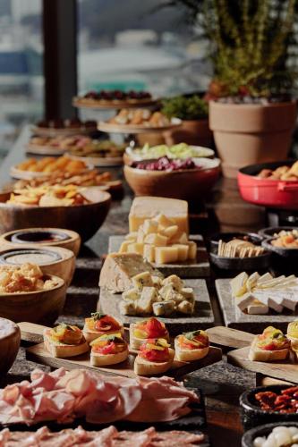 a bunch of different types of food on a table at Park Hyatt Busan in Busan