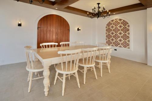 a dining room with a wooden table and chairs at Mija Casita in Anomang Mayor