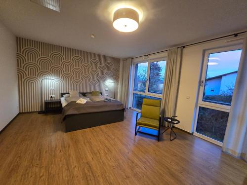 Ένα ή περισσότερα κρεβάτια σε δωμάτιο στο Fair n Square Hotel 24 Stunden Self-Check In