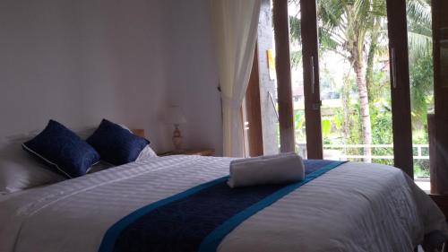 Кровать или кровати в номере Blu Mango