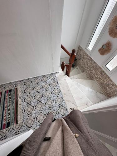 a room with a staircase with a towel on the floor at Tepe Hotel in Alaçatı