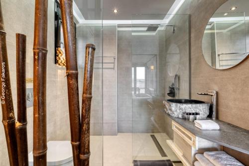 a bathroom with a shower and a sink at Villa Hendel Lefkada in Lygia