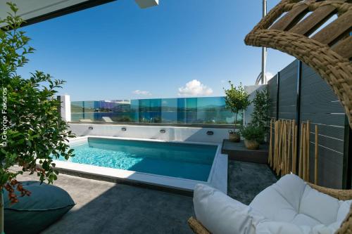 a swimming pool on the roof of a house at Villa Hendel Lefkada in Lygia