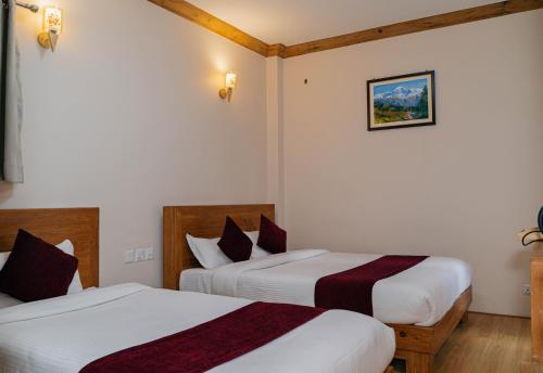 Postel nebo postele na pokoji v ubytování Bardali Restro and Residency