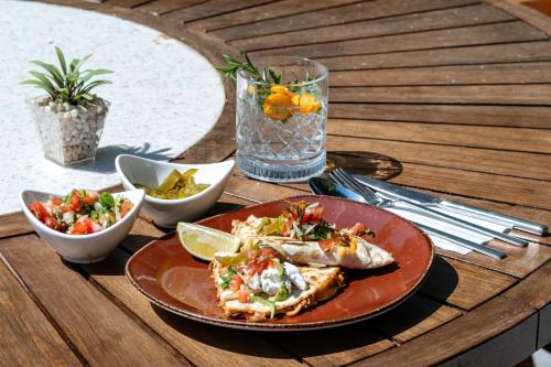 a plate of food on a table with a plate of food at Hotel Centro Bodrum in Bodrum City