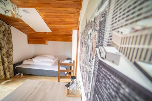 a room with a bed and a wall at Keutschacherhof in Keutschach am See