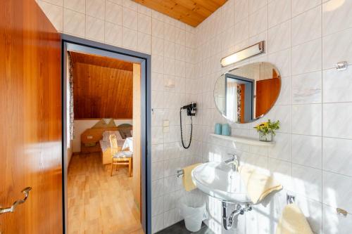 a bathroom with a sink and a mirror at Familienbauernhof Glawischnig-Hofer in Gmünd in Kärnten