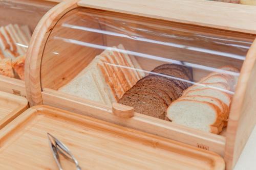 a wooden box with two slices of bread in it at Ada Hotel in Tashkent