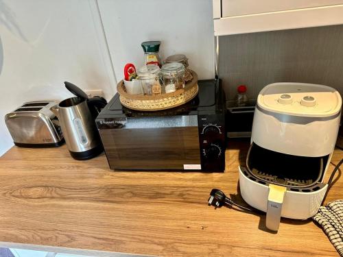 a coffee maker sitting on top of a kitchen counter at Apple tree hut, in a private garden in Skipton