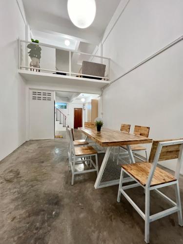 a dining room with a table and chairs at Sabay Home in Bangkok