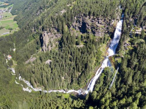 an aerial view of a river in a forest at MyHome Apartments Umhausen in Umhausen