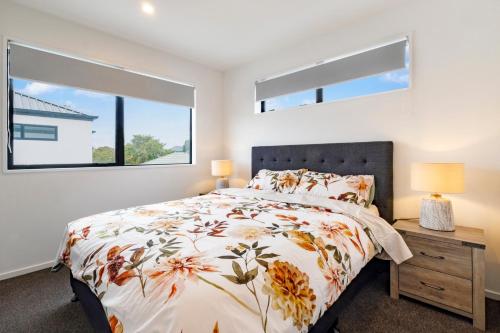 a bedroom with a bed and a window at Entire Brand New Home in Christchurch