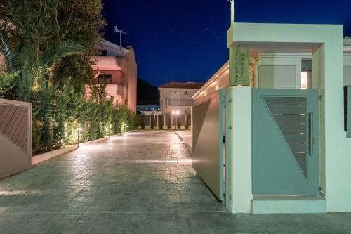 an empty street at night with an open door at Ariadne's House in Sami