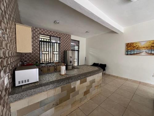 a kitchen with a counter top in a room at BELINDA APPARTEMENT in Rubavu