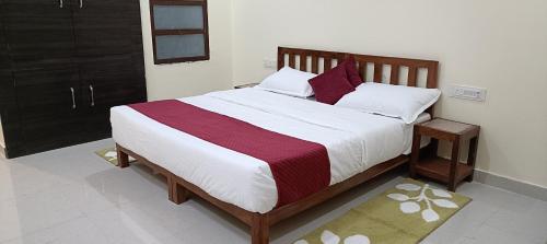En eller flere senge i et værelse på Chitra Niwas Palighat