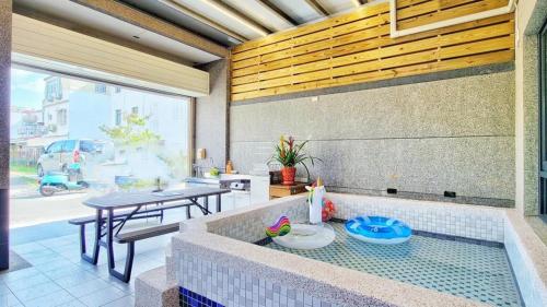 a patio with a table and a table and a table at Pengjia Villa in Hengchun South Gate