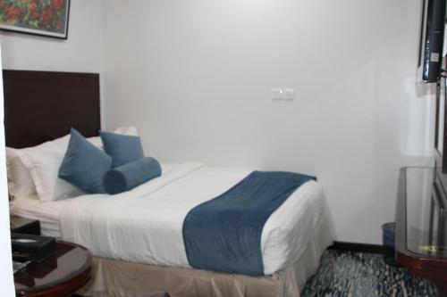 Postel nebo postele na pokoji v ubytování Carawan Al Khaleej Hotel Olaya
