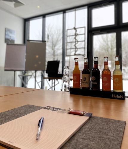 a group of bottles of beer sitting on a table at Nordic Avantage Hotel in Kiel