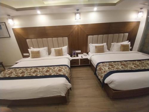 Postel nebo postele na pokoji v ubytování Effotel By Sayaji Dehradun