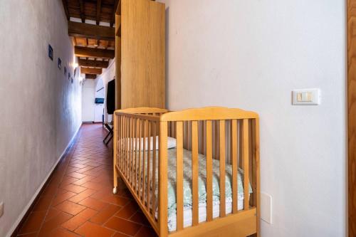 a nursery with two cribs in a room at La Dimora nell'Anfiteatro Superior room and apartment Self check in Elevator Air Conditioning in Lucca