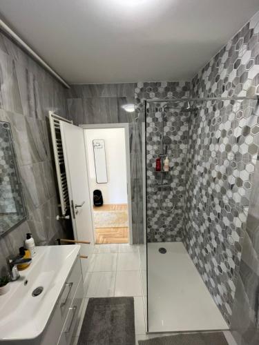 a bathroom with a shower and a sink at Sweet yellow in Zagreb